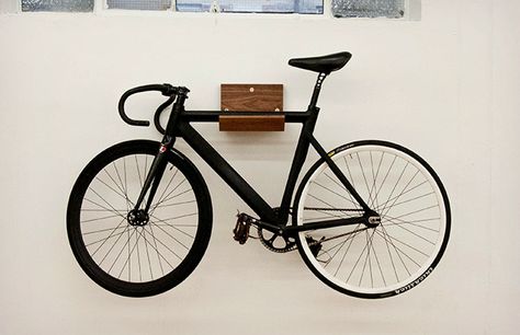 http://coolmaterial.com/home/make-bike-rack/ Rack Velo, Indoor Bike Rack, Indoor Bike Storage, Simple Bike, Wall Mount Bike Rack, Bike Rack Wall, Bike Shelf, Cycle Storage, Bike Wall Mount