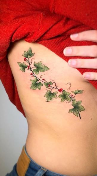 Ivy Vine Tattoo For Women, Ivy With Flowers Tattoo, Ivy Rib Tattoo, Holly Vine Tattoo, Holly And Ivy Tattoo, Vine Side Tattoo, Cherry Vine Tattoo, Grapevine Tattoos For Women, Flowering Vine Tattoo