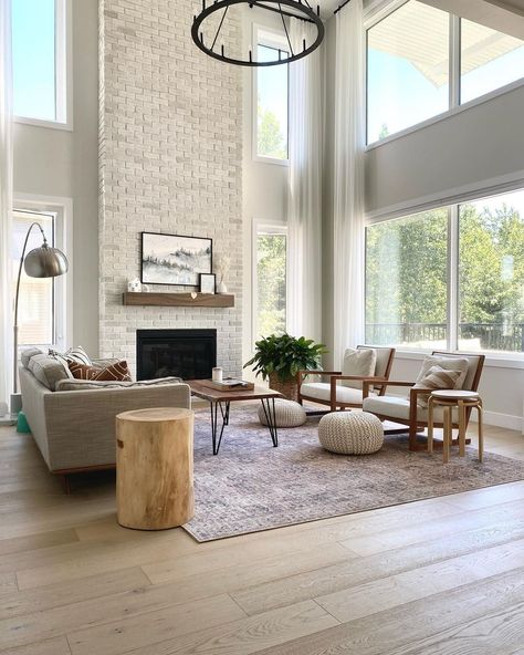 High Ceiling Sitting Room Ideas, Fireplace Stone Floor To Ceiling, High Peak Ceiling Living Room, High Ceiling Living Room Windows, Tall Fireplace Living Room, Living Room High Ceilings Big Windows, Living Room With Big Window Ideas, Tall Fireplace Wall High Ceilings Tile, High Ceiling Chimney Ideas