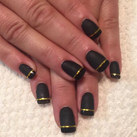 Black nails with gold stripes Black Nails With Gold French Tip, Nails With Gold French Tip, Matte Black Nails With Gold, Black Nails With Gold, Gold French Tip, Black Gold Nails, Nails With Gold, Matte Black Nails, White Chrome