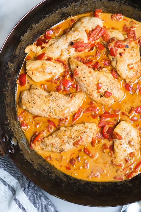 Looking for an easy chicken recipe? This roasted red pepper chicken recipe can be made in your skillet in less than 30 minutes! It's low carb and can is the perfect skillet supper to throw together for your weeknight dinner. So if you're in the market for more chicken recipes, this is it! #chickenrecipe #chickenrecipeseasy #chicken #chickenrecipeshealthy #skilletsupper #skilletideas #skilletrecipes #chickenskilletrecipe Red Pepper And Chicken Recipes, Roasted Red Pepper Recipes Chicken, Creamy Chicken With Roasted Red Peppers, Roasted Red Pepper Chicken Chili, Creamy Red Pepper Chicken, Chicken And Pepper Recipes Healthy, Chicken And Roasted Red Peppers Dinners, Roasted Red Pepper Chicken Crockpot, Roasted Red Pepper And Chicken Recipes