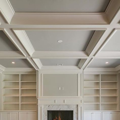 Ariella Horowitz on Instagram: "Built ins and a coffered ceiling for the family room #familyroom #trimwork #builtins #ceilingdesign #cofferedceiling #classic #timeless #transitionaldesign #hamptonsstyle #fireplace #marblesurround #naturallight #hardwoodfloors #designer #designideas #interiordesign #homebuilder #newconstruction #bergencounty #njrealestate #hgtv #luxuryliving #luxuryhomes #the_real_houses_of_ig  #inspire_me_home_decor #oakdriveproject" Great Room With Coffered Ceiling, Coffered Ceiling Fireplace, Coffered Ceiling Ideas Living Room Wood, Living Room With Coffered Ceiling, Modern Coffered Ceiling Design, Coffered Ceiling Open Floor Plan, Coffered Ceiling With Fireplace, Simple Coffered Ceiling, Ceiling Square Design