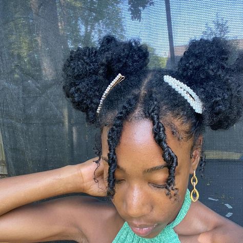 Natural hair, space buns, green dress, pearl clips, middle parts Space Bun Natural Hair, Space Buns Coily Hair, 2 Space Buns, Space Buns With Bangs, Curly Space Buns, Space Buns Hair, Super Curly Hair, Spiral Braid, Space Buns