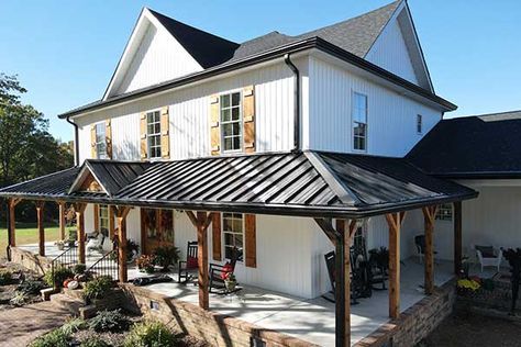 Black Metal Roof Farmhouse White Siding, Metal Roof Covered Patio, Tin Roof Front Porch Addition, Metal Roof On Porch, Metal Roof Historic Home, White Brick House Metal Roof, Metal Covered Porch, Painting A Tin Roof, White House With Copper Metal Roof