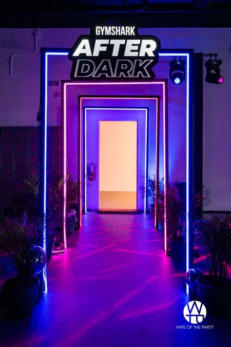 A stunning entrance way that leads to the dressing rooms where guest were able to change into their new Gymshark workout sets. #wifeoftheparty #neon #entrance #gymshark #afterdark #lights #photomoment #events #partyplanner #walkway Neon Entrance Decor, Entrance Design Event, Entrance Arch Design Event, Neon Event Decor, Neon Entrance, Nightclub Entrance, Neon Arch, Festival Entrance, Neon Event