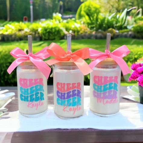 "Cheer Gifts, Cheerleading, Cheerleader, Cheer Season, Cheerleader Gifts, Personalized Cheer Tumbler, Cheer Team Gifts, Gifts for Cheerleader Such cute CHEER tumblers in a fun retro font! The perfect personalized gift. Everyone loves something personalized, made just for them! These make great gifts for cheer teams!  These glass tumblers are perfect for both hot & cold drinks.  We made these with frozen vanilla smoothies - everyone had so much fun in the process :) You can opt to purchase the glass tumbler only or include the bamboo lid & glass straw! Glass: These are 16oz. glass tumblers. Lids: These mason jar lids with straw holes are made of quality bamboo material, which is safe, without BPA and phthalates, and they are easy to clean, so you can use them for a long time. Glass Straws i Cheer Leading Gifts Ideas, Cheer Birthday Gifts, Cheer Goodies Team Gifts, Christmas Team Gifts, Cheer Presents, Cute Cheer Gifts For Team, Cheer Gift Bags For Team, Cheer Coach Gift Basket Ideas, Cheer Coach Appreciation Gifts