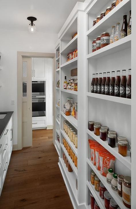 Storage is a necessity in a pantry and this well-designed pantry closet features just that. Pantry With Shallow Shelves, Narrow Pantry Doors, Narrow Long Pantry Ideas, Walk In Pantry Wall Ideas, Shallow Wall Pantry Ideas, Shallow Shelves Kitchen, Narrow Shelf Pantry, Shallow Pantry Shelving Ideas, Pantry Narrow