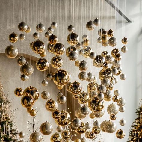 Suspended Christmas Decorations, Christmas Decor In Restaurant, Holiday Restaurant Decor, Ornaments Hanging From Ceiling, Christmas Decoration Restaurant, Christmas Decorations Ceiling, Office Christmas Decorations Ideas, Hanging Ornaments From Ceiling, Olive Green Velvet Sofa