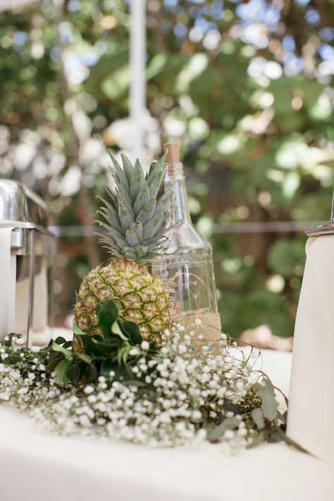 Tropical Inspired Wedding Reception Decor, Pineapple, White Baby's Breathe, Empty Wine Bottle Centerpiece Pineapple Centerpiece Wedding, Pineapple Wedding Decor, Bright Yellow Wedding, Pineapple Centerpiece, Tropical Wedding Centerpieces, Pineapple Wedding, Yellow Wedding Inspiration, Wine Bottle Centerpieces, Tropical Beach Wedding