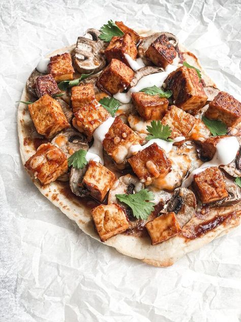 Have you ever had tofu on pizza before? I'm sure that it may sound a bit odd, but when made correctly, it can taste great! I have tried many variations of the recipe below, such as with spicy sauces, sweet and sour and more. I will have to say, that the barbeque flavour with the tofu takes it to the finish line! However, feel free to adjust this recipe to your own liking. For my recipe, I simply used a store-bought flatbread for the dough, but if you're feeling extra creative you can a… Maple Candied Bacon Recipe, Maple Candied Bacon, Tofu Pizza, Curry Chicken Thighs, Cabbage Steaks Recipe, Candied Bacon Recipe, Meat Replacement, Cabbage Steaks, Bbq Tofu