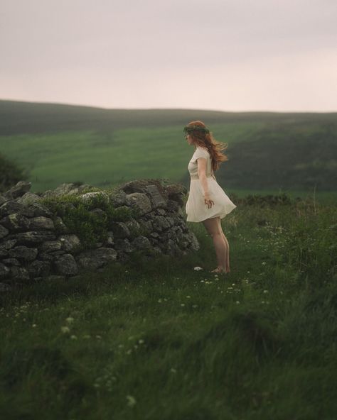 On July 5th, the Manx National Day, ancient traditions come alive. As I stand at the old Tynwald circle, the Tynwald, echoing Viking origins, holds outdoor sessions unchanged for over a millennium. Under the midsummer sky, the ceremony feels deeply pagan, forging a timeless connection to the land and its enduring spirit. #isleofman #iomstory #enchantedliving #faeriemagazine #visitisleofman #isleofmanaesthetic #folklore #legends #manx #celtichistory #vikinghistory #femalecreators #sonyalphafe... Folklore Legends, Ancient Kingdom, July 5th, Viking History, Manx, I Stand, National Day, Isle Of Man, Stand By Me