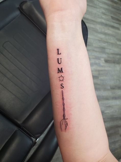 Simplistic Harry Potter Tattoo, Lumos Tattoo, Lumos Wand Tattoo, Forearm Tattoo Harry Potter, Harry Potter Tattoos Lumos, Harry Potter Wand Tattoo Arm, Harry Potter Lumos, Birthdate Tattoo, Wand Tattoo