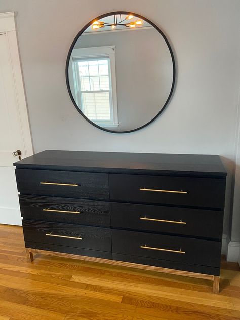 Black Ikea Malm Dresser hack, brass pull, wood base/legs, mid-century, west elm alexa vision Black Dresser Hardware Ideas, Malm Furniture Makeover, Ikea Malm Pulls, Malm Dresser Leg Hack, Dresser Base, Diy Black Dresser, Ikea Malm Dresser Base, Black Ikea Dresser Makeover, Adding Legs To Ikea Malm Dresser