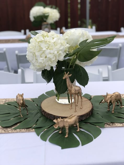 Safari Theme Party Centerpieces, Centerpieces For Safari Theme, Animal Themed Centerpieces, Jungle Safari Table Decorations, Safari Baby Shower Boy Flowers, Wild One Centerpieces Birthday, Safari Party Table Decor, Jungle Centerpieces Ideas Safari Theme, Two Wild Centerpieces