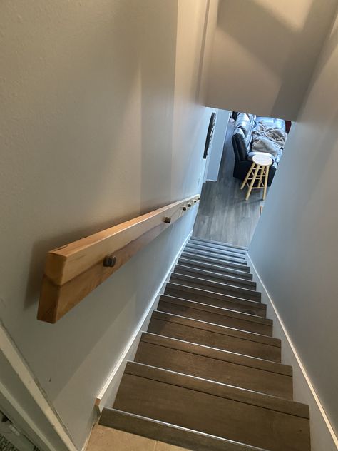 Our new stairway is narrow. Steve made this low profile hand rail from wood he milled and some pipe fittings. Works perfectly and leaves plenty of room on the stairway. Stairway Hand Rail Ideas, Basement Hand Railing Ideas, Stair Hand Rails Ideas, Narrow Stairway Handrail, Bannister Rail Ideas, Low Profile Stair Railing, Stair Railing For Narrow Stairs, Stair Hand Railing Ideas Diy, Indoor Stair Handrail Ideas