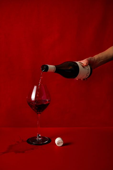 Hand pouring a glass of red wine on red backdrop Wine Pouring Aesthetic, Red Wine Product Photography, Red Wine Photoshoot, Red Wine Supernova Aesthetic, Red Photography Aesthetic, Red Wine Photography, Wine Bottle Pouring, Vino Aesthetic, Wine Commercial