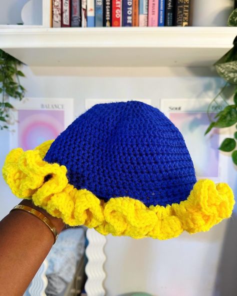 SGRho Chelly Hat 💛💙🐩 | available on my Etsy ($45) - - - #crochet #blackowned #chellyhat #buckethat #pink #handmade #SigmaGammaRho #SGRho #SigmaGammaRhoSorority #SGRhomerchandise #blacksorority Ruffle Bucket Hat, Sigma Gamma Rho, Crochet Art, Chicago Il, Sorority, Acrylic Yarn, Bucket Hat, Art Collection, Chicago