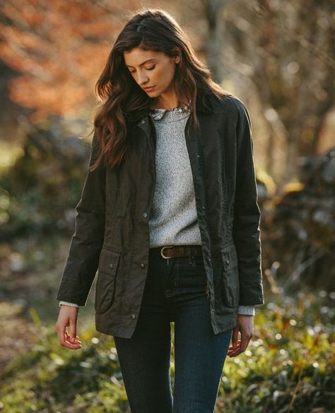 Barbour Classic Beadnell Women's Waxed Jacket | Olive⁠ Barbour's Country range offers the timeless Beadnell jacket, which is crafted from their signature Sylkoil waxed cotton. This material ensures long-lasting protection against the elements, while the inner lining features the recognizable Classic Tartan pattern. The relaxed fit of the jacket is enhanced by the inclusion of two stud-fastened vents at the back, which provide both comfort and a feminine silhouette. Other notable features incl... Old English Outfit, Country Casual Outfits Women, Field Jacket Outfit Womens, Green Barn Jacket Outfit, Barbour Outfit Woman, Wax Jacket Outfit Womens, Styling Barbour Jacket, Barbour Beadnell Outfit, Ll Bean Aesthetic