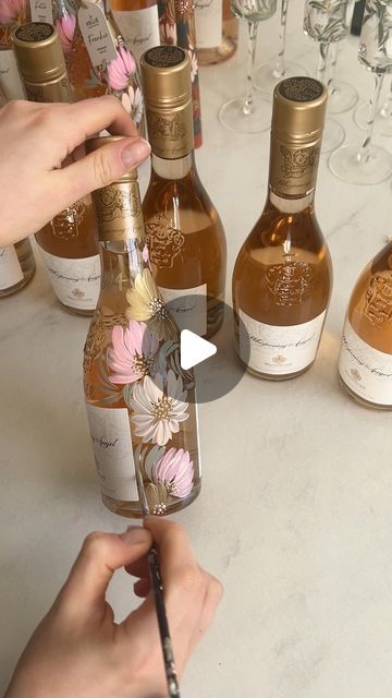 288K views · 14K likes | Hollie Yarwood on Instagram: "A little bit of pretty, country cowboy love this evening🎀  #handpaintedbottles #bridesmaids #country #countryandwestern #cowboylove #henparty #hendo #weddinggifts #giftsformygirls #bridesmaids #formybridesmaids #bridal #bride2024 #bride2025 #bridaltiktok #giftinspo #giftideas #weddingfavours #bottleart #engaged #newlyengaged #formyengaged #byhollieuk #cowboyhendo #countrywedding #specialgifts #whisperingangel #paintedwhisperingangel #proposal #bridesmaidproposal" Bridesmaid Present Ideas, Country Bridesmaid Proposal Ideas, Western Wedding Bridesmaids Proposal, Bridesmaid Proposal Cowgirl, Bridesmaid Proposal Western, Bridal Proposal Ideas, Bridesmaid Proposal Alcohol, Engagement Party Gift Ideas, Cute Bridesmaid Proposals