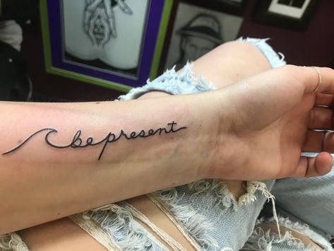 Be present wave tattoo on wrist Wave Name Tattoo, Waves On Wrist Tattoo, Wave Tattoo With Name, Wave On Wrist Tattoo, Wave Tattoo Around Wrist, Meaning Of Wave Tattoo, Ocean Wave Tattoo With Name, Be Present Tattoo, Wave Tattoo Wrist