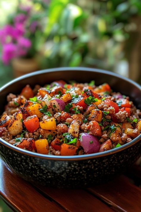 A bowl of diced vegetables and meat garnished with herbs. Ground Pork Recipes For Dinner, Thai Minced Pork, Ground Pork Recipe, Pork Dinner Ideas, Pork Empanadas, Pork Meatloaf, Juicy Meatballs, Pork Dinners, Pork Egg Rolls