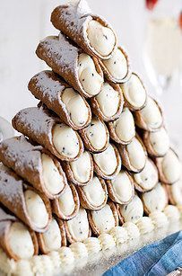 Serve your guests a mountainous pile of cannoli instead of a wedding cake. http://www.buzzfeed.com/nataliebrown/dreamy-alternatives-to-traditional-wedding-cake?crlt.pid=camp.PQRHxEiDwME8 Wedding ideas Canoli Table Wedding, Wedding Cannoli, Cannoli Tower, Non Traditional Wedding Cake, Unique Wedding Food, Italian Custard, Ricotta Cream, Cannoli Cake, Cake Alternatives