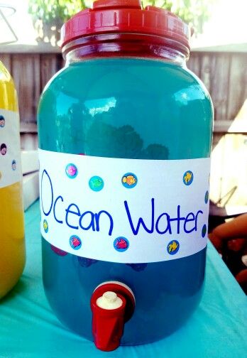 Ocean water for ocean or beach themed birthday parties! Everyone loved it. Ingredients: Blue Hawaiian Punch Lemonade You can also add some sprite if you like. I didn't measure anything out, I just did it to taste. We had children at the party so no alcohol was in this drink, but it also goes great with vodka for the adults! Birthday Beach Theme Decorations, Bora Bora Themed Party, 50th Birthday Ocean Theme, Ocean Themed Party Snacks, Beach Birthday Party Games, Bluey Birthday Beach Party, Beach Theam Birthday Party, Spongebob Drinks Alcohol, Beach Theme Birthday Party For Teens