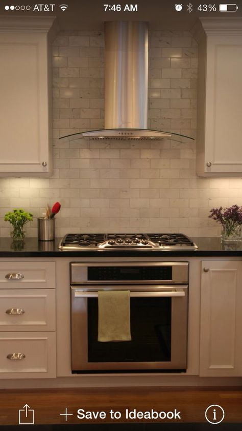 Tile all the way up around range. Hood like this. Carrera Marble Backsplash, Black Granite Countertops, Herringbone Backsplash, Classic Kitchen, Kitchen Hoods, Kitchen Decorating, Kitchen Tile, Kitchen Redo, Trendy Kitchen