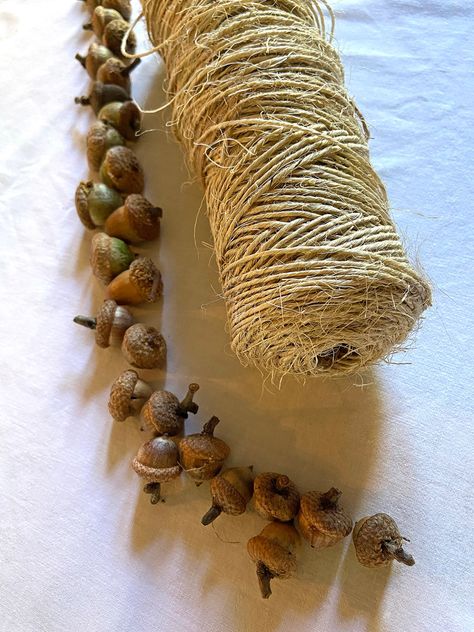 How to make acorn garland for fall - Wisconsin Magpie Halloween Acorn Crafts, Fall Nature Decorations, Acorn Wedding Decor, Fall Decor Natural Diy, How To Make An Acorn Necklace, Fall Nature Decor, Fall Pine Cone Decorations, Wood Acorn Crafts, Cottagecore Fall Decor Diy