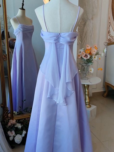 Step into a world of magic and elegance with this stunning Vintage Purple Satin Fairy Dress. The luxurious satin fabric in a dreamy purple hue drapes beautifully, exuding timeless charm and sophistication. The spaghetti straps add a touch of delicate femininity, making it perfect for any enchanting occasion. The highlight of this gown is the whimsical back wings design, adding a fairy-tale-like allure.   Garment Size   	 		 			Size 			XS 			S 			M 			L 			XL 			2XL 		 		 			Bust 			76 			80 			8 Strapless Lavender Dress, Simple Long Purple Dress, Pastel Purple Formal Dress, Periwinkle Dress Aesthetic, Dress Bodice Styles, Vintage Formal Dresses 1950s, Draped Back Dress, Silk Ruffle Dress, Period Piece Dresses