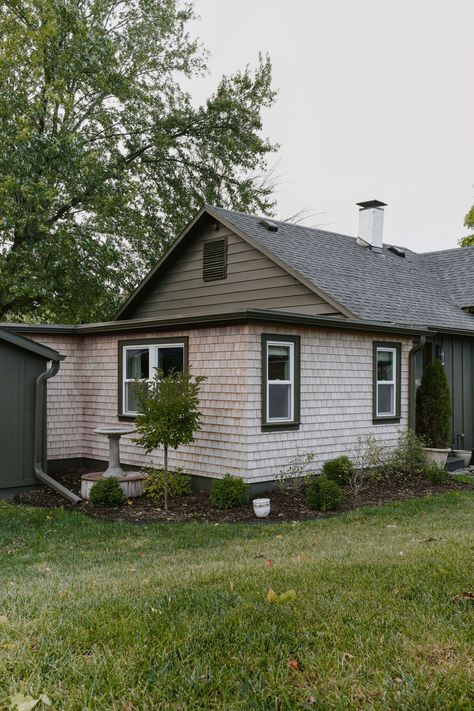 How quickly does cedar shake shingle siding turn gray? Cedar shake siding color change timeline. How to get gray cedar shake siding. Cedar shake siding inspiration. The color difference of cedar shake siding from day 1 vs year 3. Hunter green exterior paint color. Muddled Basil by sherwin williams. Cabin inspired exterior design. #cedarshakes #cedarsiding #cedarshakesiding White Cedar Shake House, Cedar Shake Accent Exterior, Cedar Shake Siding Accent, Cedar Shake Siding Colors, Shake Shingle Siding, Siding Inspiration, Cedar Shake House, Thrifted Vases, Muddled Basil