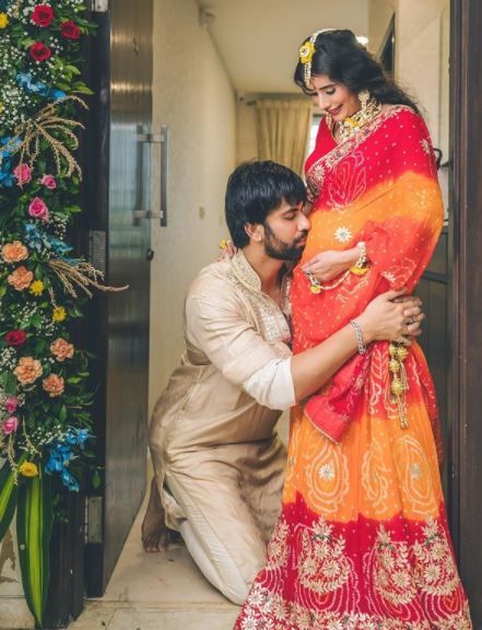 Charu Asopa is enjoying all the attention and pampering from her family and in-laws as she is expecting her first baby with Rajeev Sen. It was in May 2021, when Charu had announced the news of her pregnancy, making her fans happy. And since then, we have been witnessing glimpses from her pregnancy diary.    On August 23, 2021, Charu Asopa and Rajeev Sen shared glimpses from her baby shower ceremony which took place in their new home. For the baby shower, Charu had looked gorgeous in an o Baby Shower Mom Outfit, Charu Asopa, Babysitting Tips, Saree Pose, Sweet Couples, Shower Photography, Pregnancy Diary, Baby Shower Photography, Pregnancy Problems