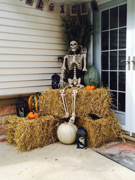 Decorating With Pumpkins Outdoor, Skeletons On Porch, Skeleton On House Halloween, Wrap Around Porch Halloween Decor, Skeleton Witch Front Porch, Hanging Skeletons On House, Skelton On Front Porch, Halloween Patio, Thanksgiving Decorations Outdoor