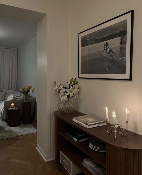 Couch In Center Of Room, Armchair Bedroom Aesthetic, Decorating Around A Radiator, Vintage Chic Apartment, Cocktail Room Ideas, Midcentury Modern Apartment Aesthetic, Dark Wood Apartment Decor, Nyc Studio Apartment Layout, Nightstand Decor With Lamp