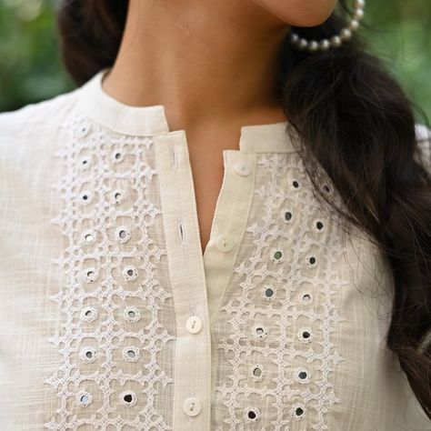 Welcome the gentle embrace of spring with the Jasmine Colletion 🌸✨ This three quarter sleeves, round neck cotton top is a symphony of style and comfort, featuring intricate hand-embroidered Sindhi embroidery and sparkling mirror work accents on the yoke. A quintessential piece for navigating the fresh beginnings of spring. Lovingly handcrafted by skilled artisans of Bikaner & Barmer in Rajasthan. . . #Spring #Springishere #Jasmine #whiteshirt #Jasminecollection #Craftedwithlove Sindhi Embroidery Design, Sindhi Embroidery, Fresh Beginnings, Cotton Kurti Designs, Embroidery Neck Designs, Cotton Kurti, Job Work, Shirt Embroidery, Mirror Work