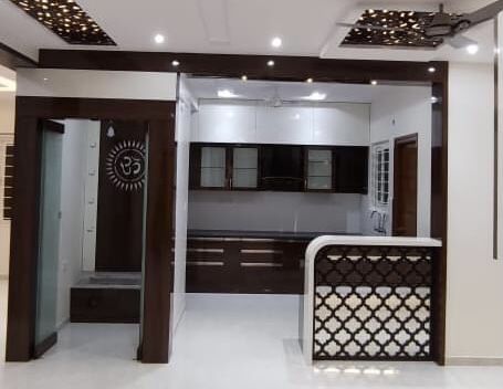 Puja Room In Kitchen, Kitchen With Pooja Room Design, Mandir In Kitchen Ideas, Open Kitchen Ideas Indian, Small Pooja Room Ideas, Indian Kitchen Ideas, Kitchen Ideas Indian, Kitchen Partition, Modular Kitchen Cabinets