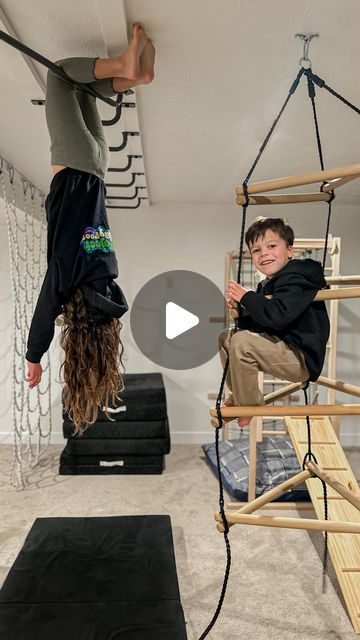 Emily Russo | Content creator on Instagram: "The monkey bar phase of our playroom is finally finished! 👏🏻 I cannot tell you how big of a hit these have been, we have had over a dozen kids over in the last few weeks and we could hardly pry them out of the basement. 😂  One of the best things about the addition of monkey bars is that you can scale up your playroom without losing any floor space! Whether you have a large playroom or smaller adding monkey bars creates a lot of opportunities for creative play! The @projectplayrooms bars are incredible quality and their customer service is top notch. If you’re looking to expand your kiddos play area they have a ton of fun products!   #projectplayroom #playroominspiration #grossmotorskills #grossmotorplay #creativeplay #monkeybars #playroominte Jungle Gym Basement, Ceiling Monkey Bars, Diy Active Playroom, Playroom Monkey Bars, Active Playroom, Large Playroom, Indoor Monkey Bars, Basement Ideas For Kids, Ninja Warrior Course