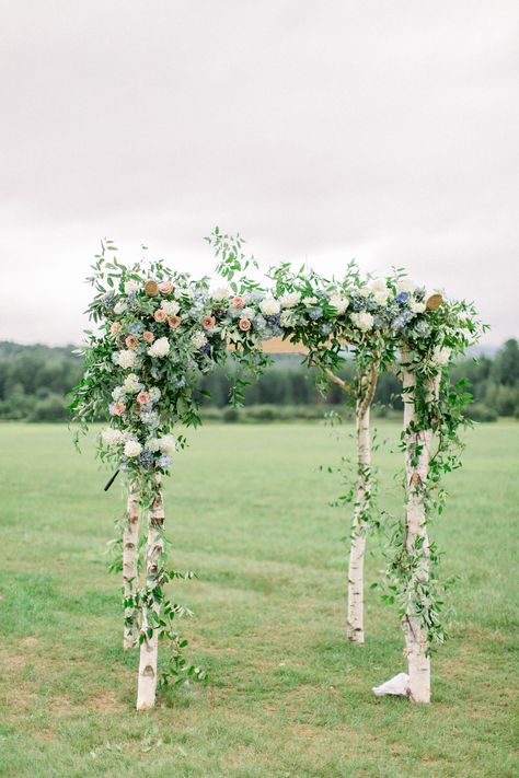 Florist Blomma Flicka created a ceremony chuppah with birch wood, hydrangeas, roses, and greenery. Because Josh is Jewish, "it was really important to us that we got married under a chuppah and that Josh broke the glass," Lauren says. "I still remember the loud 'Mazel Tov!' that echoed through the field once he did it!" Birch Chuppah, Chuppah Flowers, Whimsical Wedding Theme, Olive Branch Wedding, Wedding Chuppah, Funky Wedding, Wedding Ceremony Ideas, Stowe Vermont, Vermont Wedding