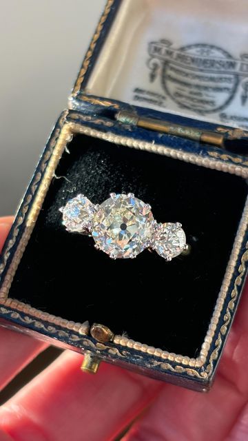 Wave Antiques on Instagram: "New In 💍 A 4.87ct old cut diamond 3 stone ring. The central diamond is 3.58ct estimate L/SI2 and the side diamonds have a combined weight of 1.29ct. This piece is set in platinum and 18ct yellow gold.   Not yet online! Available for £19,950   #oldcutdiamond #diamond #diamondring #engagementring #engagementringideas #engagementringgoals #engagementringinspiration #engagementringinspo #jewellery #antique #antiquejewellery #antiquejewelryaddiction #antiquejewels #antiquejewelryforsale #antiquejewelry #antiquejewelryforsale #vintagejewels #vintage #vintagejewellery #vintagejewelryforsale #vintagejewelry" Antique Engagement Rings Edwardian, Antique Engagement Rings Vintage 1920s, Unique Engagement Rings Vintage Antiques, Brilliant Cut Engagement Ring, Brilliant Cut Engagement Rings, 3 Stone Ring, Antique Engagement Rings Vintage, Engagement Ring Inspiration, Vintage Engagement Rings Unique