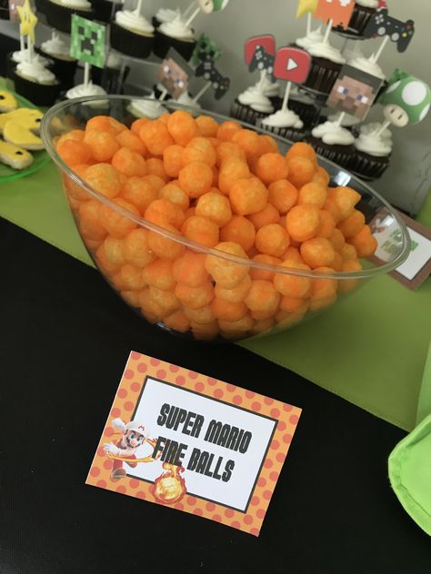 Gamer party food.. super Mario fire balls (cheese balls) Video Game Birthday Party Snacks, Gamer Party Snacks, Gamer Themed Birthday Party Food, Super Mario Bros Party Desserts, Gaming Party Food Ideas, Video Game Themed Food, Video Game Food Ideas, Mario Kart Party Food, Mario Party Desserts