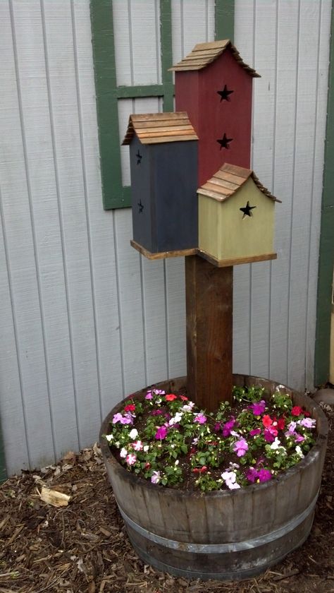 Make one with solar light Instead...Triple Birdhouse in Whiskey Barrel add cabin number. Bird Houses On Posts, Birdhouse Post Ideas, Permanent Campsite Decorating Ideas, Permanent Campsite, Spring Garden Ideas, Ideas For Front Yard, Birdhouse Garden, Spring Garden Decor, Ideas For Backyard