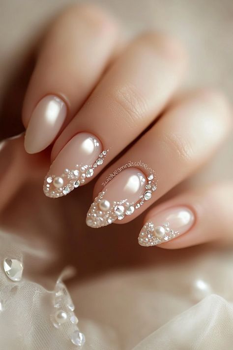 Wedding day manicure. French tips with pearl accents and small crystal details.

First impressions last a lifetime - and that’s why every detail matters on your big day, especially when it comes to your nails. Presenting 39 mix of timeless classics and trendy bridal wedding nail art designs that promise to make your ring exchange even more photogenic. Whether you're all about…

Read more: https://tastywed.com/generated-post-39-creative-bridal-wedding-nail-art-designs-and-tips/ Pearl Bridal Nails, Bridal Manicure Wedding Nails Ideas, Brides Nails For Wedding, Bridal Nail Art Designs Wedding Day, Bridal French Manicure, Pearl Wedding Nails, Wedding Nail Art Designs, Elegant Bridal Nails, Wedding Nail Art