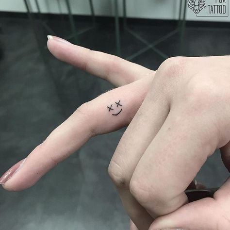 30 Best Smiley Face Tattoo Ideas 27 Mini Smiley Face Tattoo, Smile Tattoo Finger, Smiley Face Tattoos, Smile Face Tattoo, Smiley Tattoo, Face Tattoo Ideas, Emoji Tattoo, Smiley Face Tattoo, Smile Tattoo