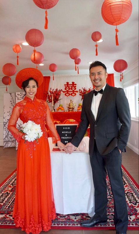 Vietnamese tea ceremony wedding. Bride is wearing the traditional red ao dai while groom is in a more modern black suit and bow tie. Red Tea Ceremony Decor, Vietnamese Wedding Ceremony, Tea Ceremony Wedding Vietnamese Decor, Vietnamese Tea Ceremony Dress, Viet Tea Ceremony, Vietnamese Engagement Ceremony, Tea Ceremony Wedding Vietnamese, Yea Ceremony, Vietnamese Tea Ceremony Decorations