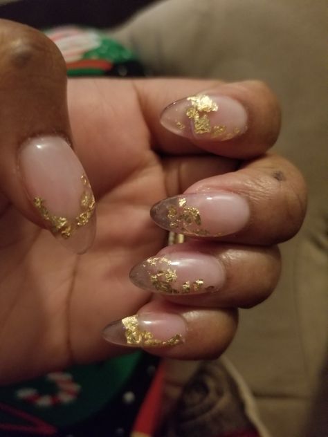 Clear nails with a yellow gold flake underlay. Clear Nails With Foil Flakes, Clear Nails With Gold Foil, Clear With Gold Flakes Nails, Clear Gold Flake Nails, Gold Flake French Tip Nails, Gold Yellow Nails, Clear And Gold Nails, Gold Accented Nail Inspiration, Gold Clear Nails