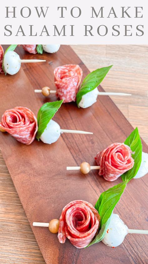 LEAH FEREZAN | SALAMI ROSES Ingredients: Salami Basil Mozzarella Balls Directions: Take 4 pieces of salami and overlap them just a bit. Then fold in… | Instagram How To Make Salami, Toothpick Appetizers, Basil Mozzarella, Mozzarella Balls, Fancy Appetizers, Cheese Sticks, Toothpick, Appetizers Easy, Creative Food