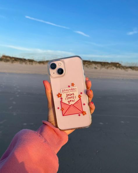 ALSO dropping on Friday August 2nd… new phone cases !!! Once again, these have been suchhh a work in progress, and I am beyond excited to launch them 🥹🫶🏼💖🌺 There will be a white case option, a pink case option, and a clear case!! The white + pink cases have the same hand drawn design (the cute little “stamps” with doodles & words about Jesus!), while the clear case has our “Reminder: Jesus Loves You” design on it 💌 These will fit most iPhones and a few Samsung options! I’ll give more info... Aesthetic Christian Phone Cases, Bible Phone Cases, Jesus Phone Cases, Phone Cases Clear, Doctor Halloween, Bible Cases, Book Art Projects, Christian Phone Case, Bday List