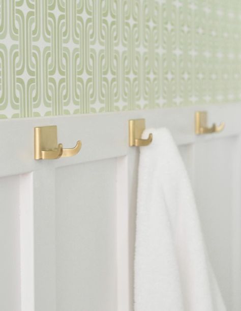 Before and After: A Builder-Grade Bathroom Gets Major Personality - Bathroom Makeover Ideas - Good Housekeeping Board And Batten Bathroom Towel Hooks, Board And Batten Towel Hooks, Board And Batten Bathroom Hooks, Gold Towel Hooks Bathroom, Gold Towel Hooks, Gold Wallpaper Bathroom, Robe Hooks Bathroom, Brushed Brass Towel Hook, Mobile Home Bathrooms