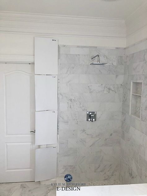 Learn all about one of the best white paint colours from Benjamin Moore, Decorators White. Discover its Lrv, undertones and its use on walls, cabinets, exteriors with marble and more! Shown here compared to other popular white paint colours from Sherwin and Benjamin with marble shower tile.  #kylieminteriors #white #whitepaintcolours #decoratorswhite #edesign #kyliemedesign #colourexpert #marble #marblecountertops #bestpaintcolours Decorators White Benjamin Moore Bathroom, Simply White Benjamin Moore Bathroom, White Paint Grey Undertone, Best White Paint With Carrara Marble, White Paint Bathroom Walls, Bathroom Paint Colors With White Tile, Carrara Marble Bathroom Paint Color, White Dove Benjamin Moore Bathroom, Atrium White Benjamin Moore Walls