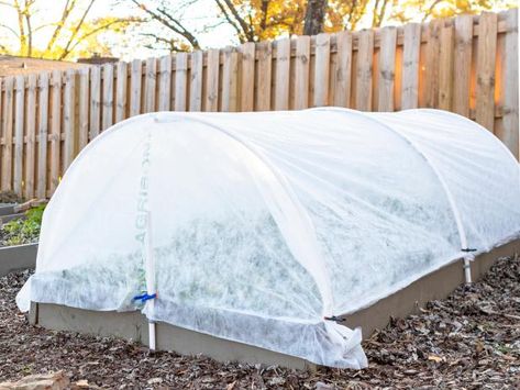 The gardening experts at HGTV show you how to make row covers for raised beds so you can extend your growing season and even get a jump on spring. Protect Plants From Frost, Low Maintenance Garden Design, Hoop House, Raised Bed Garden, Winter Vegetables Gardening, Winter Gardening, Build A Greenhouse, Row Covers, Greenhouse Plans